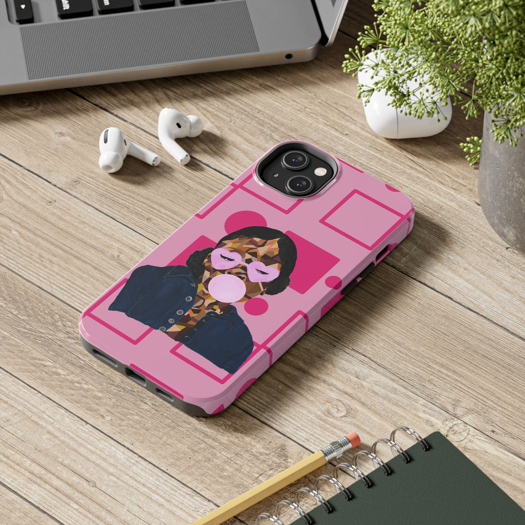 Phone case with a design on a wooden surface with a laptop, earbuds, and notebook.